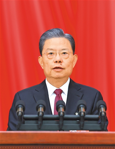 3月8日，十四屆全國人大二次會議在北京人民大會堂舉行第二次全體會議。受全國人大常委會委托，趙樂際委員長向大會報告全國人大常委會工作。 　　新華社記者 王 曄攝